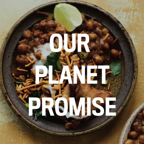 Top down view of food with our planet promise text superimposed