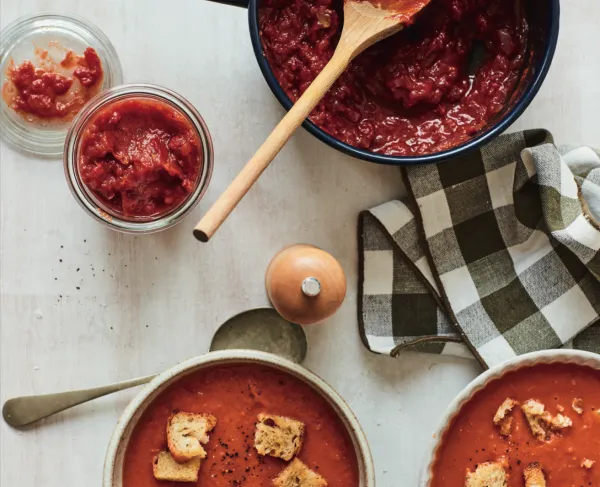 a pot of soup and bowls